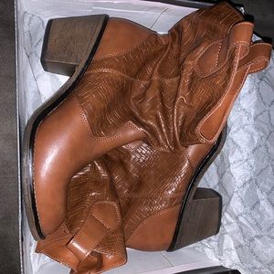 These are tucker brown X•Appeal ankle boots